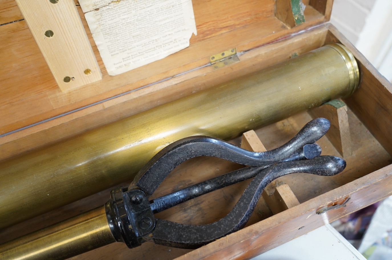 A 19th century brass telescope by Yeates & Son, Dublin, with integral brass and cast iron stand, in a pine case with labels to the inside of the lid, case 102cm long, 23cm deep, 13.5cm high. Condition - fair, splits to t